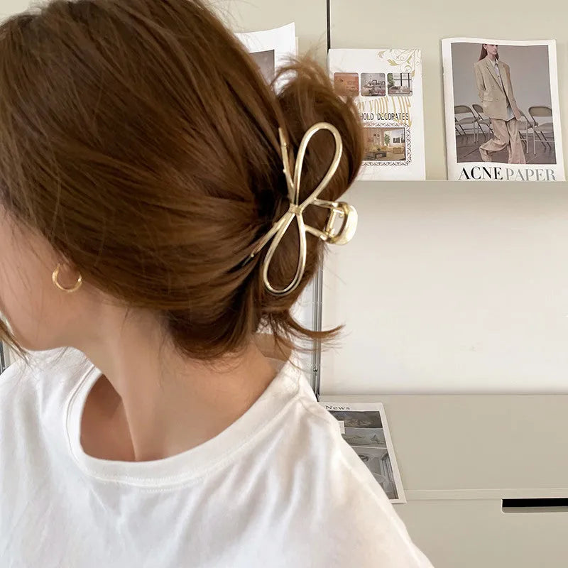 Women's bow barrette hair grip in gold or silver with Korean style design