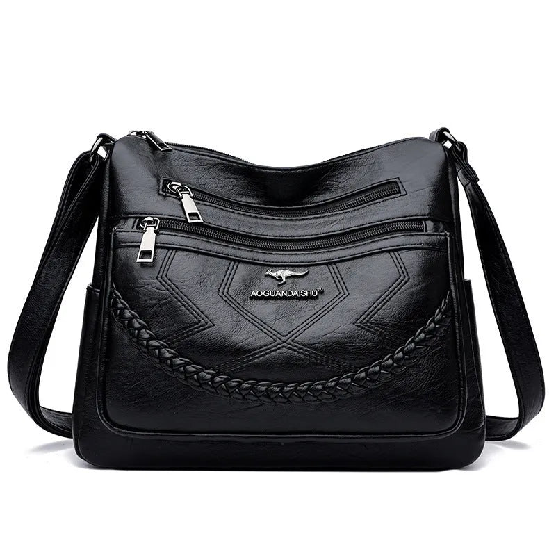 Women's black PU leather crossbody shoulder bag with large capacity and zipper compartment