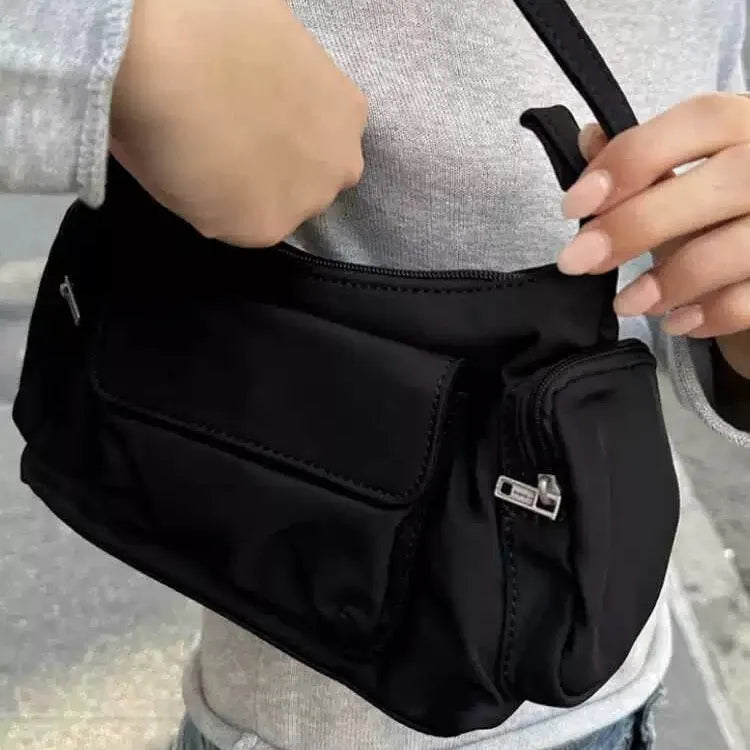 Black PU nylon double pocket shoulder bag with side line detail showing compact dimensions
