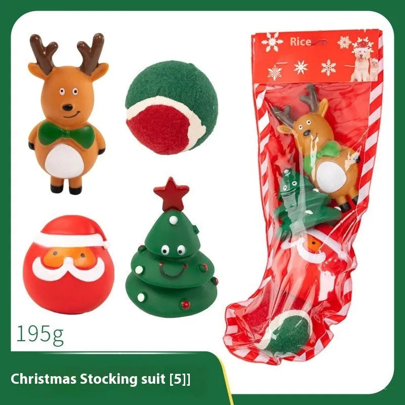 Christmas-themed vinyl dog toys including barbell, ball, rope, and Santa designs in gift packaging
