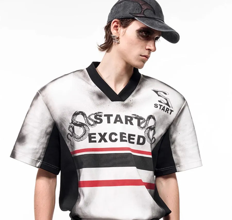 Women's V-neck short sleeve top with a printed letter snake pattern and padded shoulders.