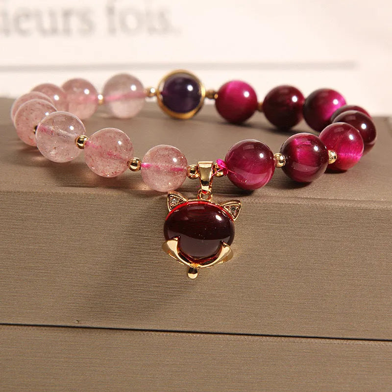 Women's strawberry crystal bracelet on elastic rope measuring 18cm with simple jewellery design
