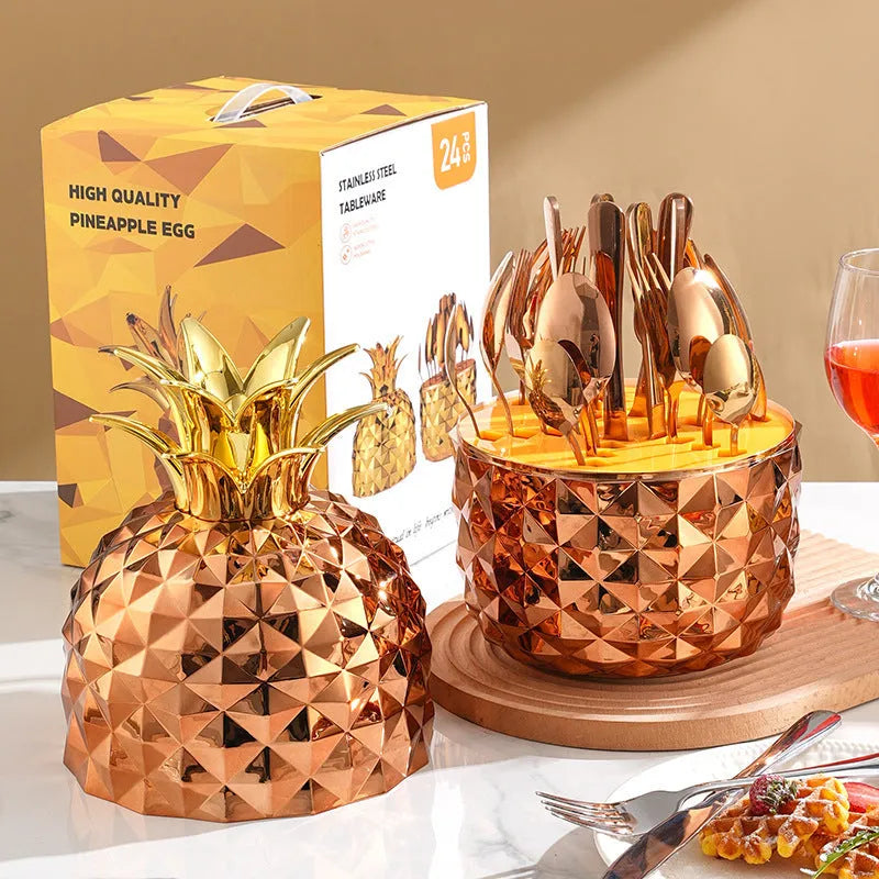 Fashion stainless steel 24-piece tableware set with mirror polish and pineapple egg design in gold finish on a dining table