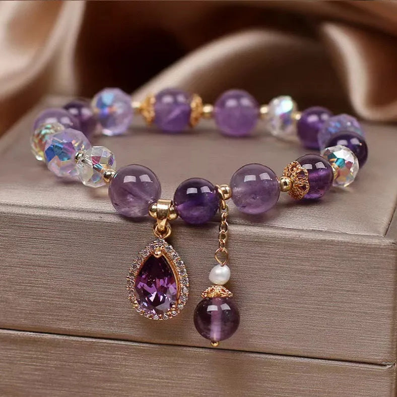 Close-up of a women's purple amethyst crystal bracelet with micro inlay detailing.