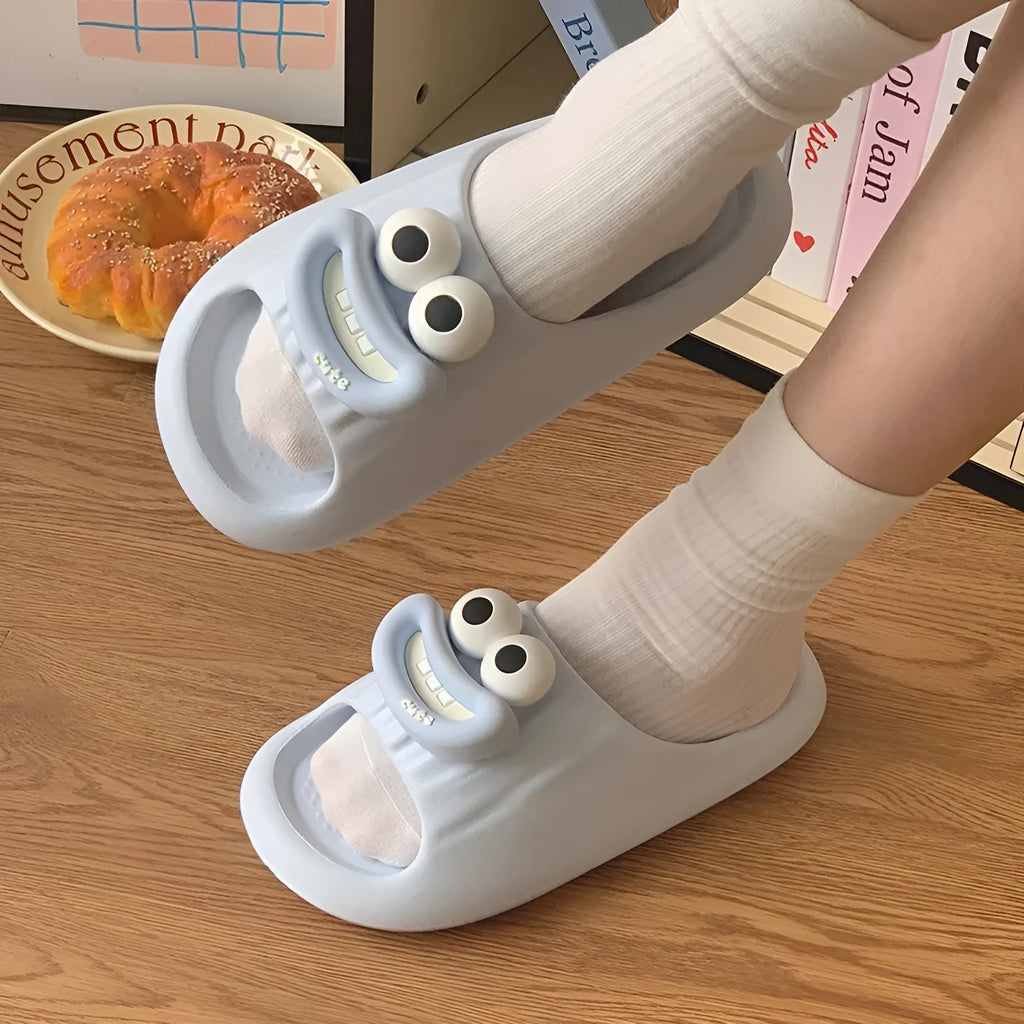 Sausage mouth slippers in light blue with soft EVA sole on wooden floor, indoor household use