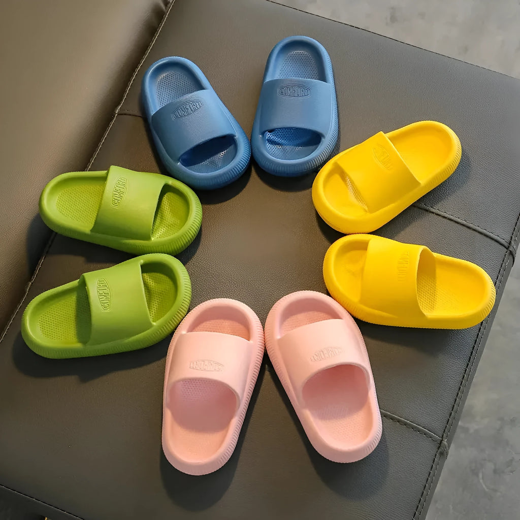 Children's bright coloured EVA slippers with non-slip soles in blue, green, orange, pink, and yellow.