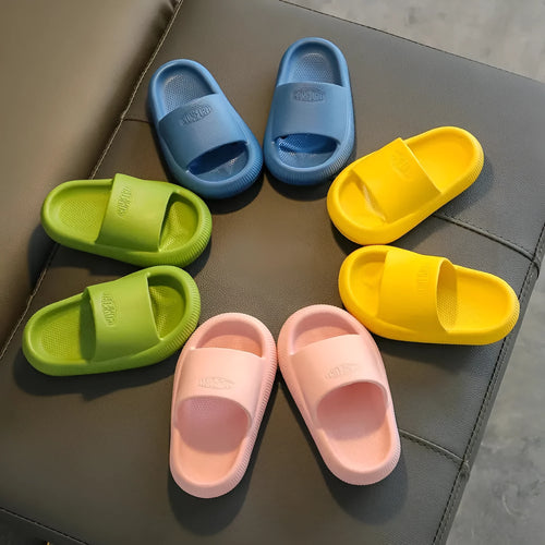 Children's bright coloured EVA slippers with non-slip soles in blue, green, orange, pink, and yellow.