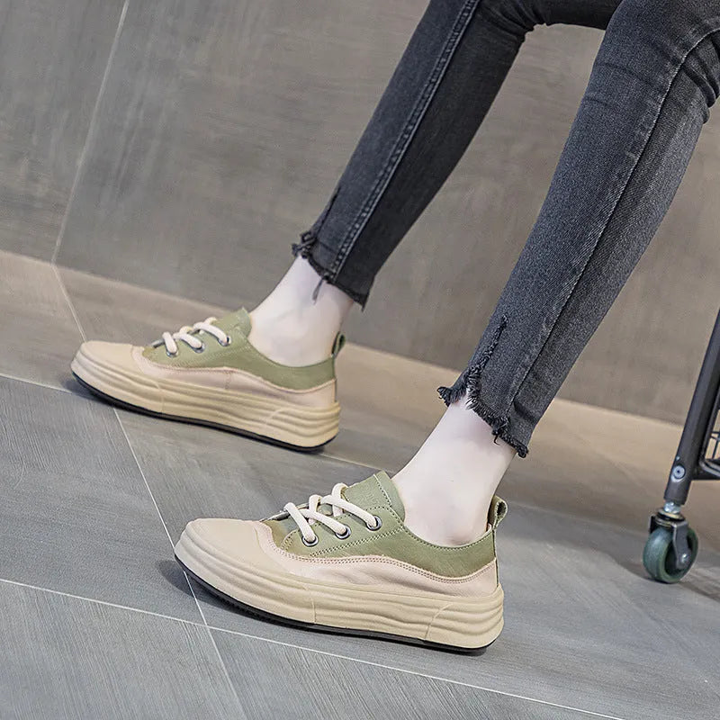 Women's leather platform sneakers in matcha green, side view showing round toe and lace-up design.