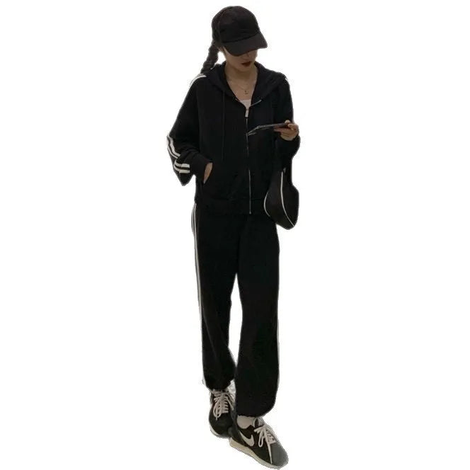 Striped polyester two-piece pants suit set for women in light gray or black with top and trousers coordinated