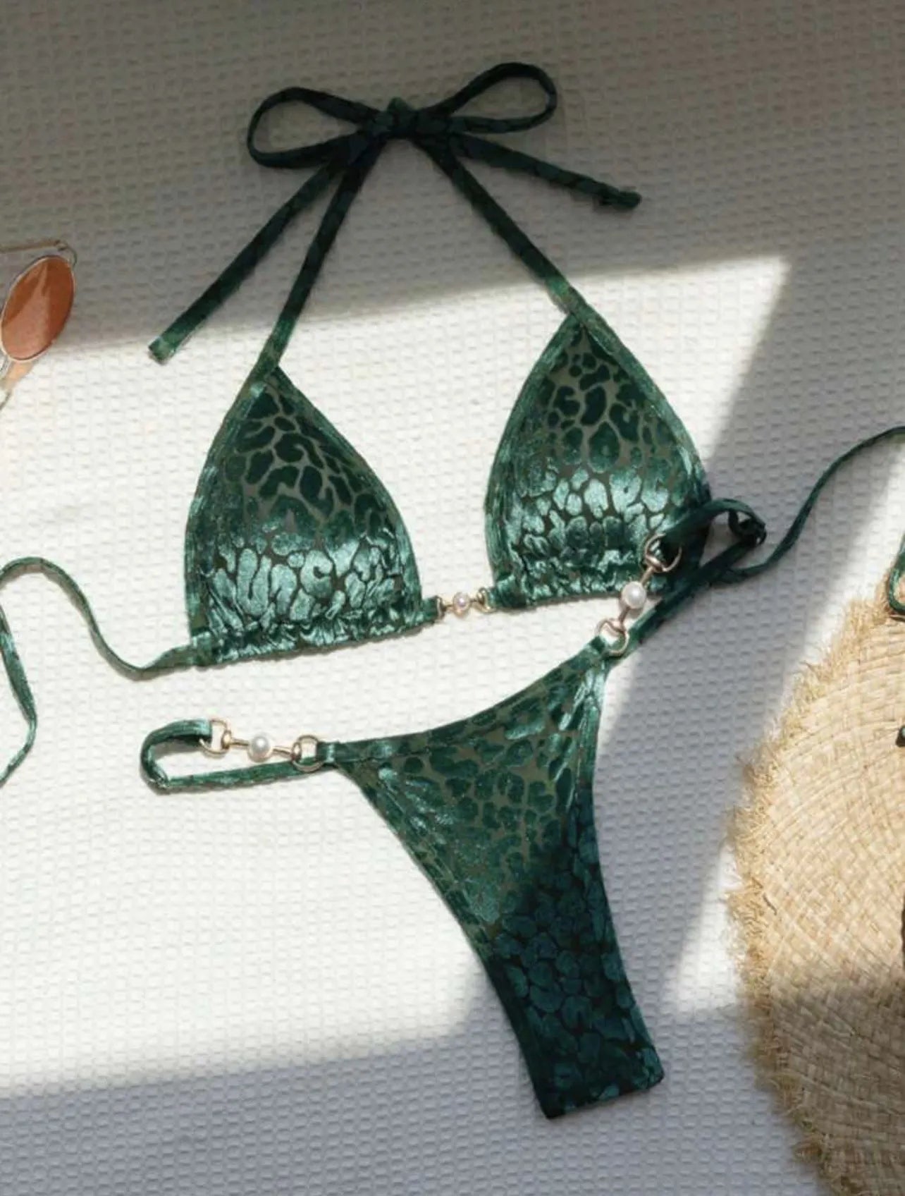 Women's blue leopard print T-shaped bikini swimsuit made from polyester and spandex fabric.