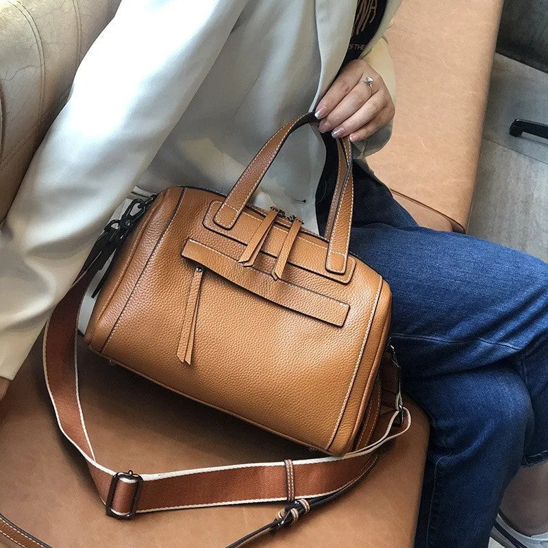 Genuine leather messenger bag with Boston lychee pattern stitching showing horizontal square shape and shoulder strap