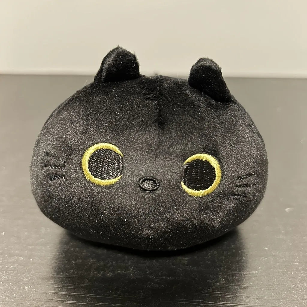 Fluffy black cartoon cat plush toy, 28cm tall, on a neutral background.