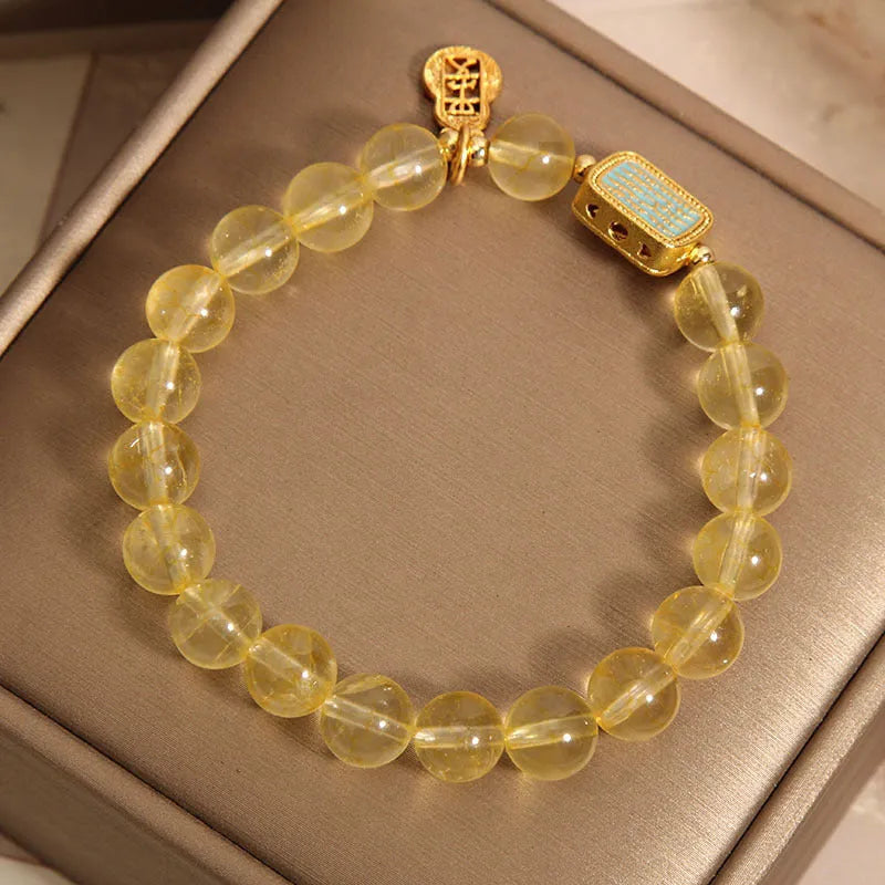 Women's citrine crystal bracelet with rhinestone decorative details showing natural yellow colour