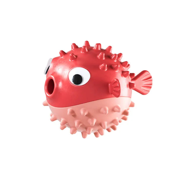 Green fish-shaped interactive dog toy with treat dispensing capability and raised surface particles
