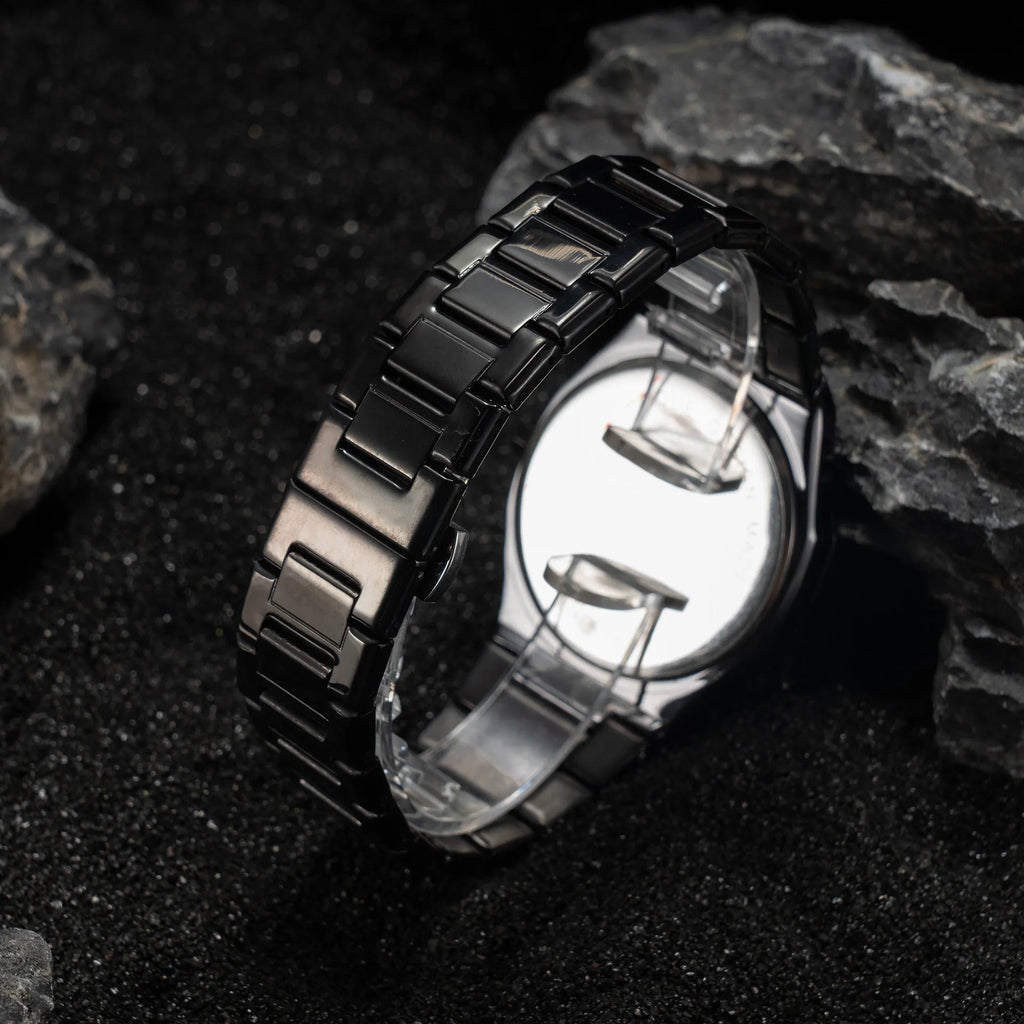 Business casual men's watch with steel strap and quartz movement, shown in black, silver, and black silver scale colour options.