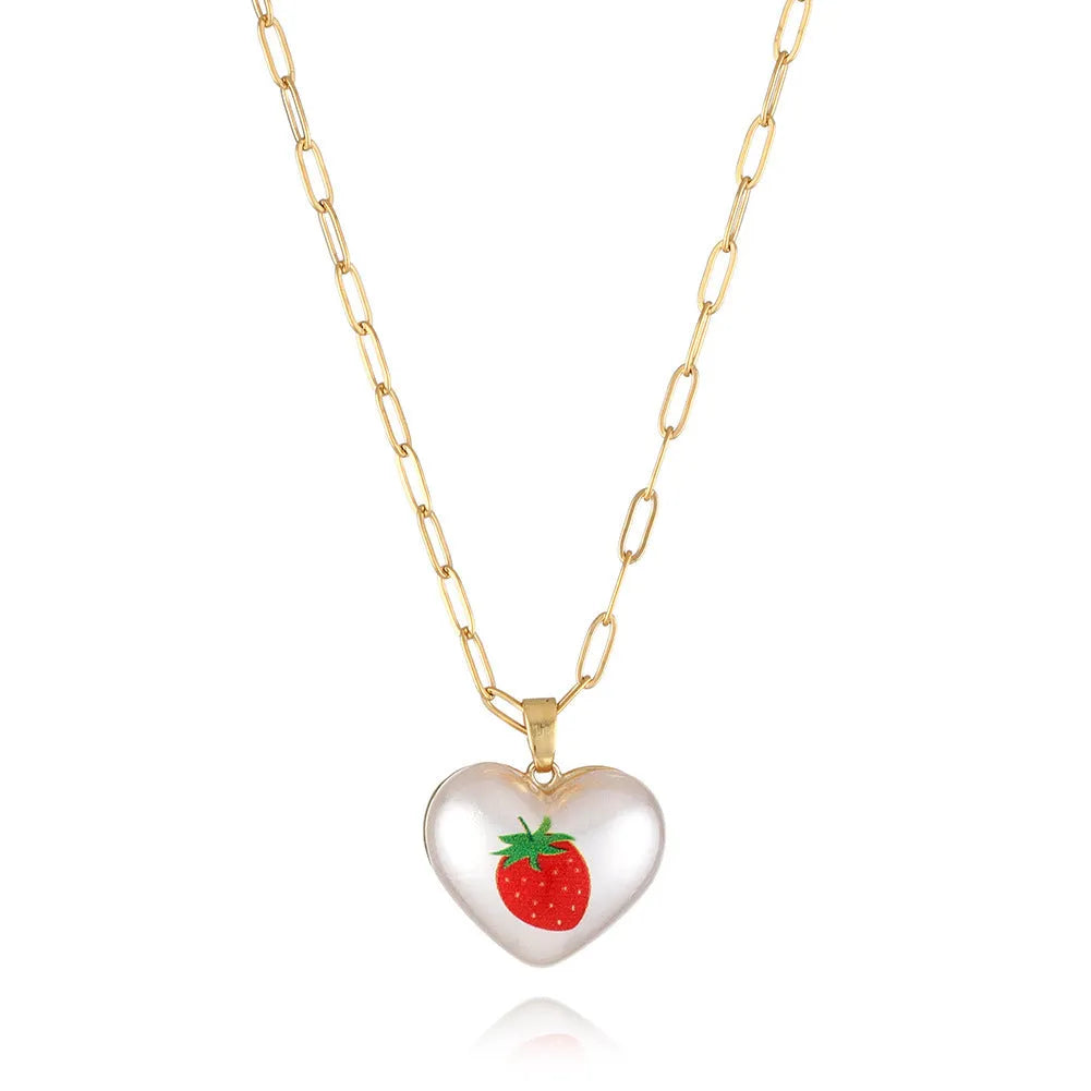Geometric fruit charm necklace with an adjustable chain, shown in strawberry, pineapple, apple, pear, and cherry colour variants.