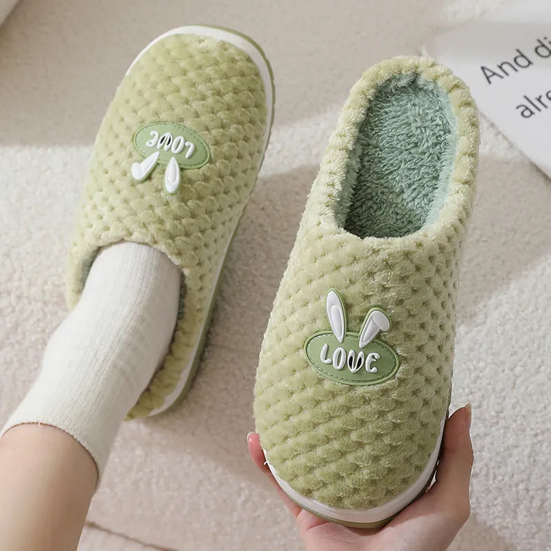 Rabbit plaid pattern women's house slippers with artificial fur upper and rubber sole.