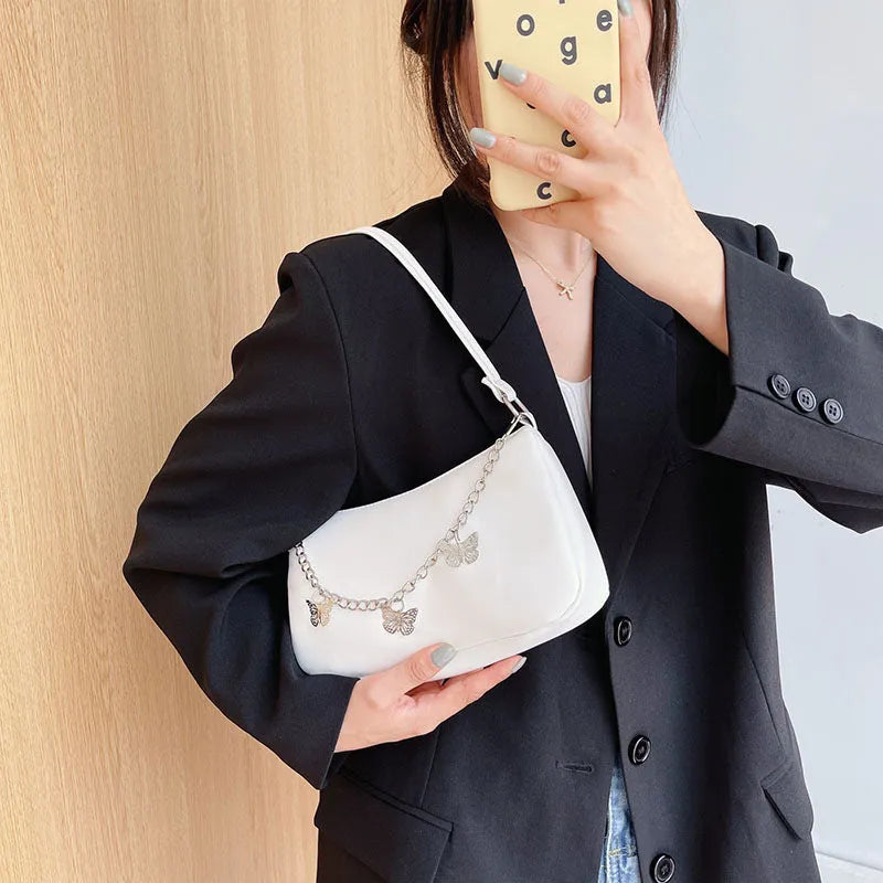 Horizontal square butterfly chain underarm bag in four colour options