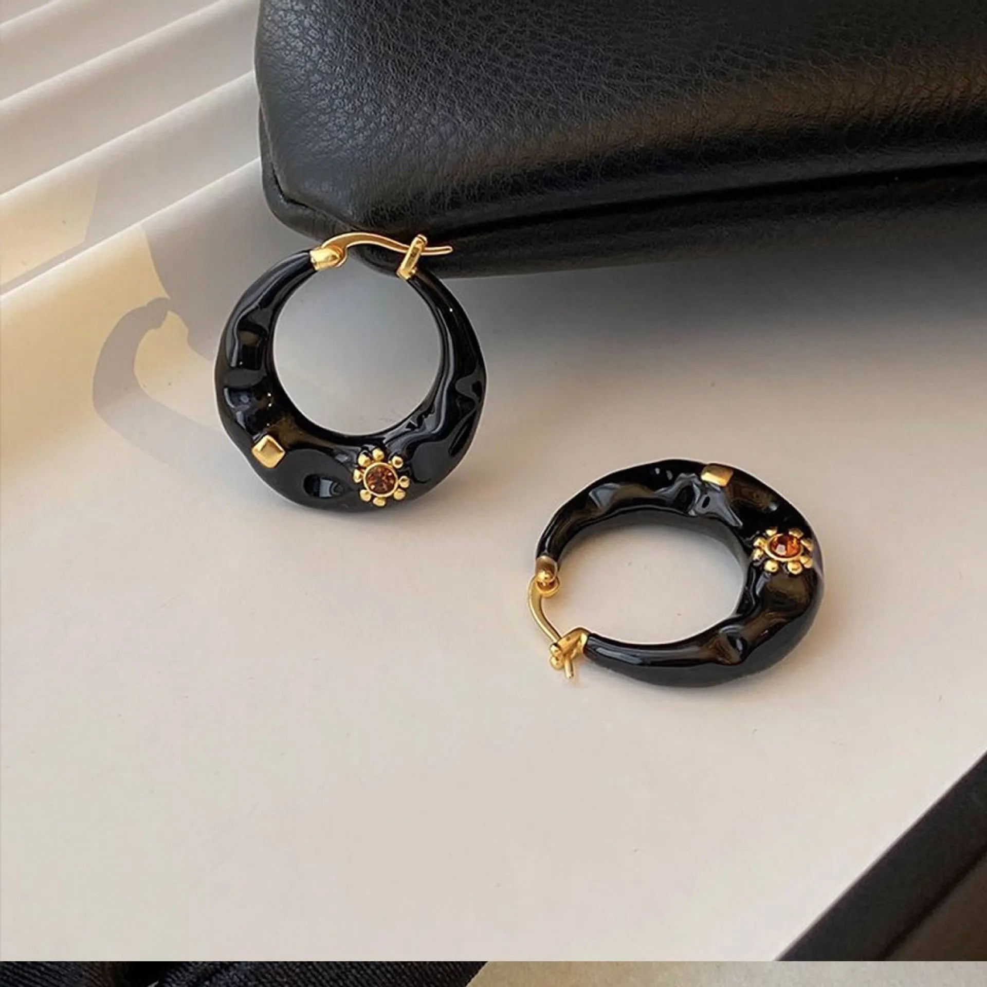 Hong Kong style retro ear studs with dripping oil finish and rhinestone inlay in black and red colours