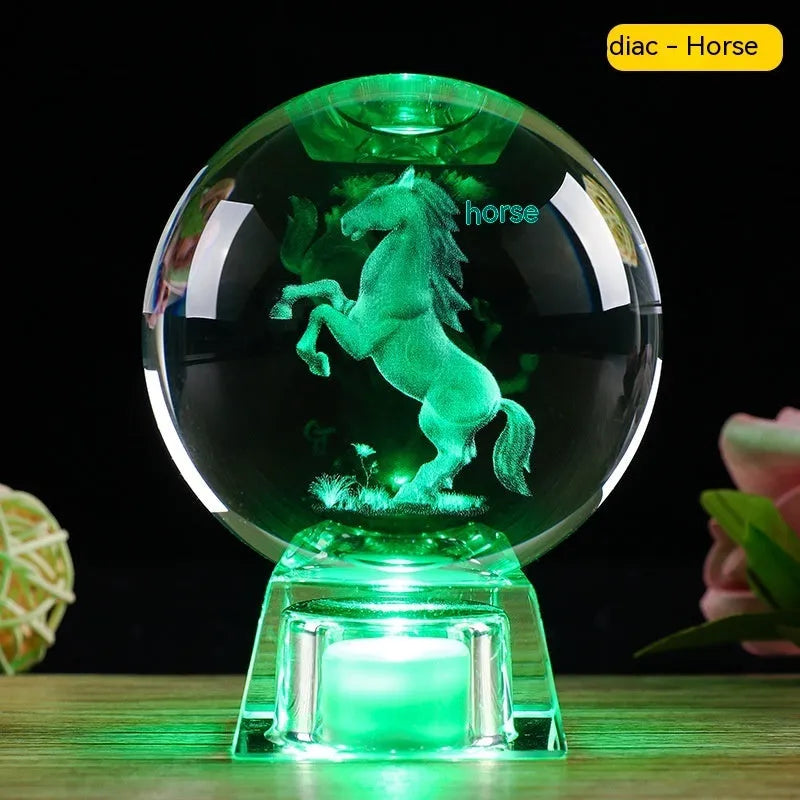 White crystal zodiac decorative ball with electronic base lighting showing Chinese-style animal design