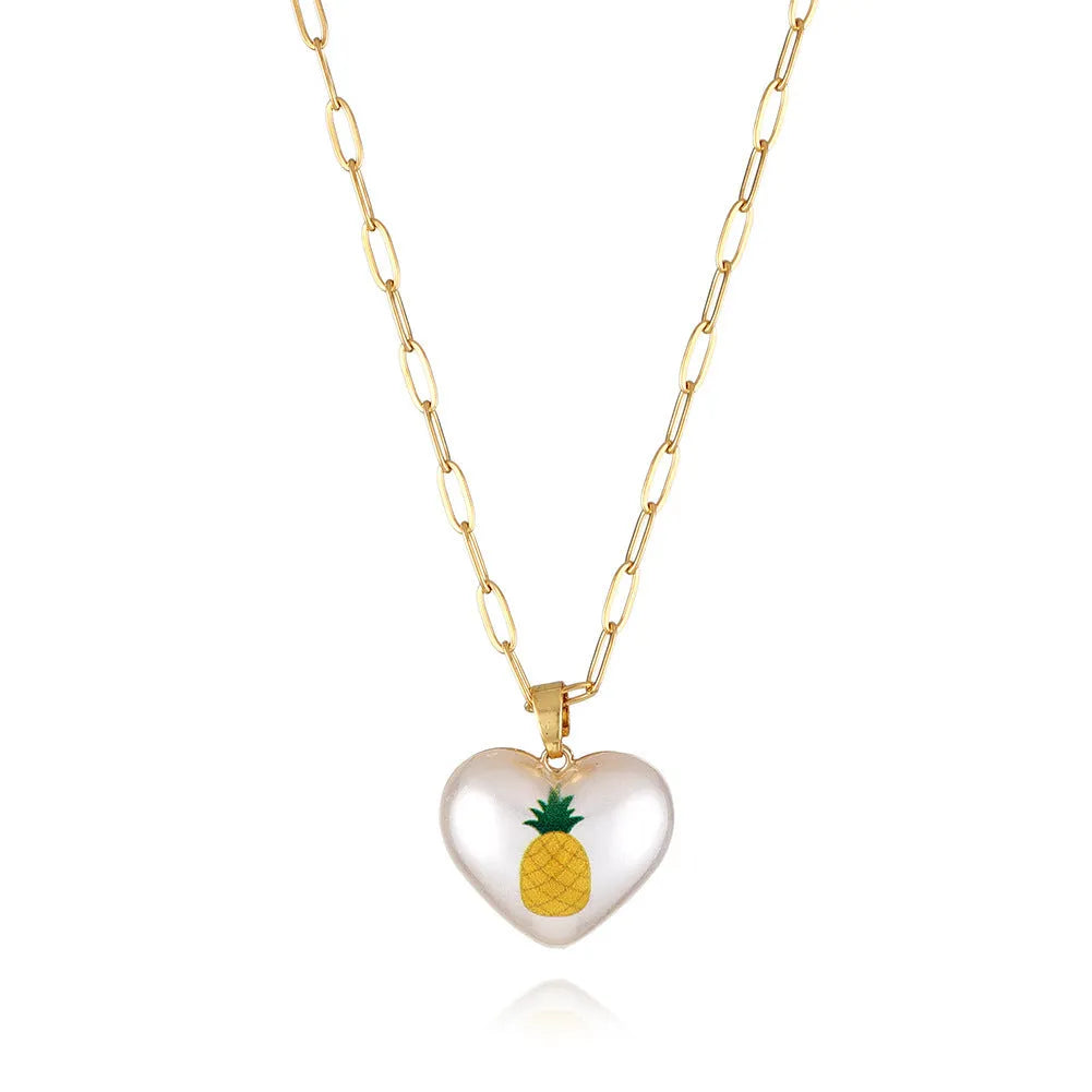 Geometric fruit charm necklace with an adjustable chain, shown in strawberry, pineapple, apple, pear, and cherry colour variants.