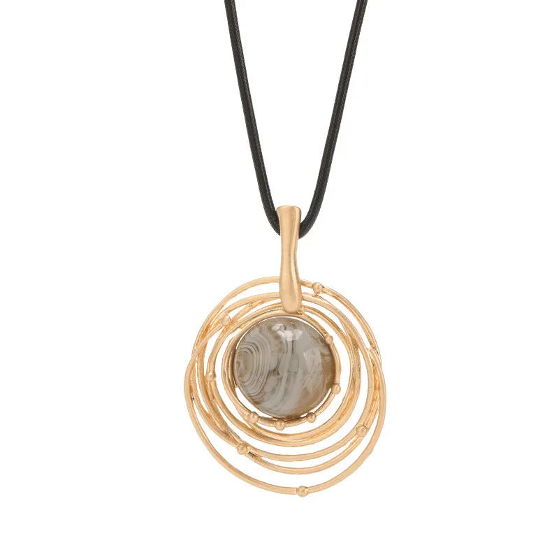 Gold tone geometric plaid pendant on a textured snakeskin wax rope chain necklace, adjustable from 51cm to 80cm.