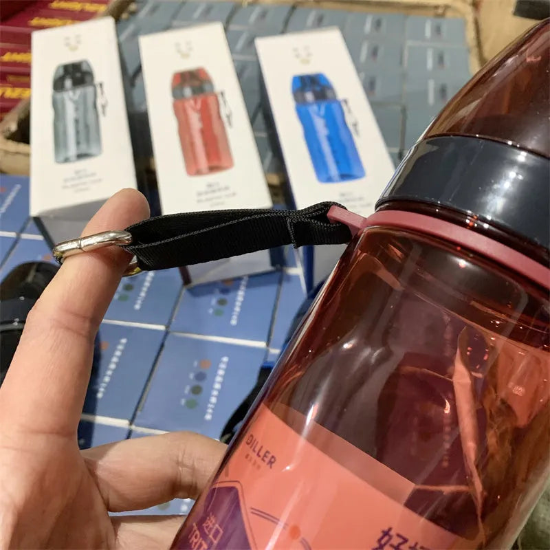 Chinese-style portable sports water bottle with tea infuser compartment in blue, red, black, or grey.