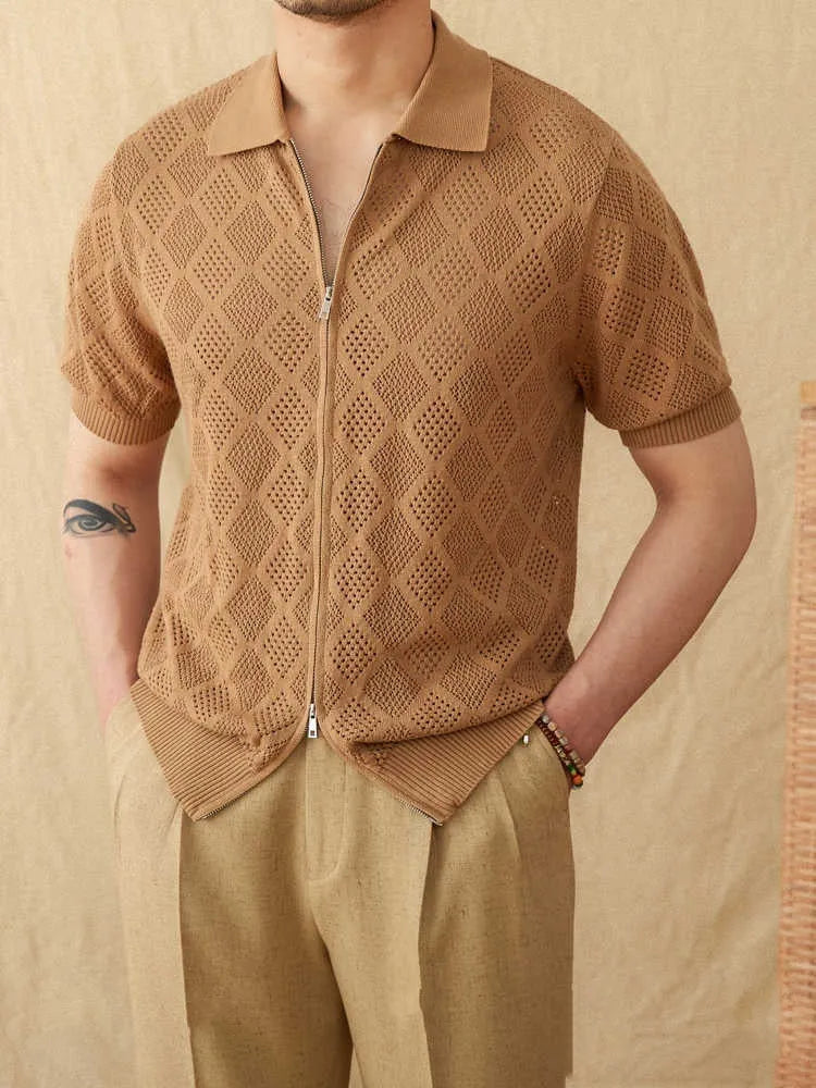 Light brown cotton short sleeve cardigan with zip front and lapel collar on a hanger