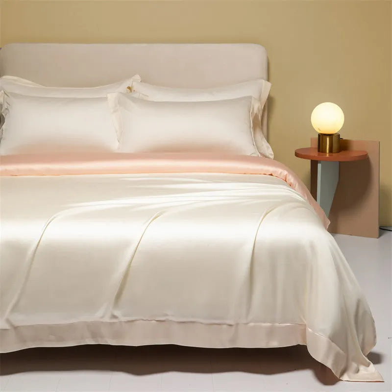 Luxury Lenzing Tencel quilt cover and pillowcase set in a modern style, showing colour options like Aurora Blue.
