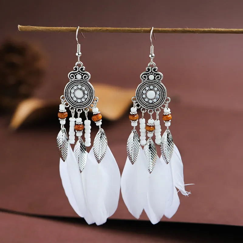 Round drop feather design alloy earrings with leaf pattern in a bohemian style, showing electroplated finish.