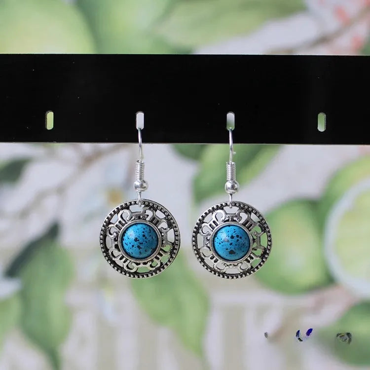 Geometric ethnic earrings with Tibetan silver and turquoise stones in traditional Miao style