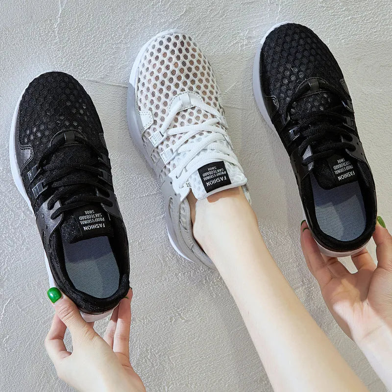 Men's low-top casual sneakers with hollow white mesh upper and round toe on a flat EVA sole.