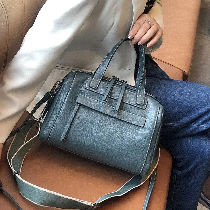 Genuine leather messenger bag with Boston lychee pattern stitching showing horizontal square shape and shoulder strap