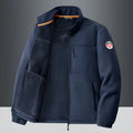 Men's grey fleece cardigan jacket with zippered pockets, shown on a model.