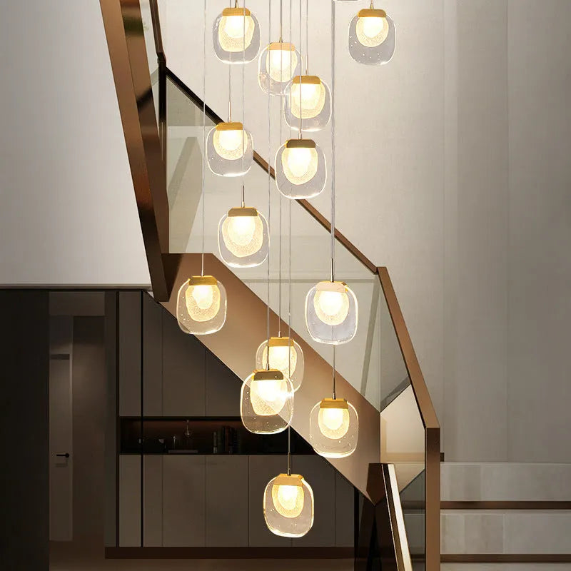 Postmodern crystal chandelier with six gold heads, stainless steel chassis, and adjustable cable on a ceiling