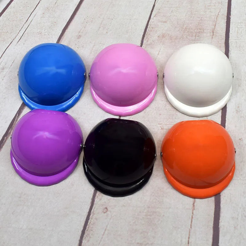 Plastic dog motorcycle-style helmet cap shown in multiple colours and sizes for small, medium, and large dogs.
