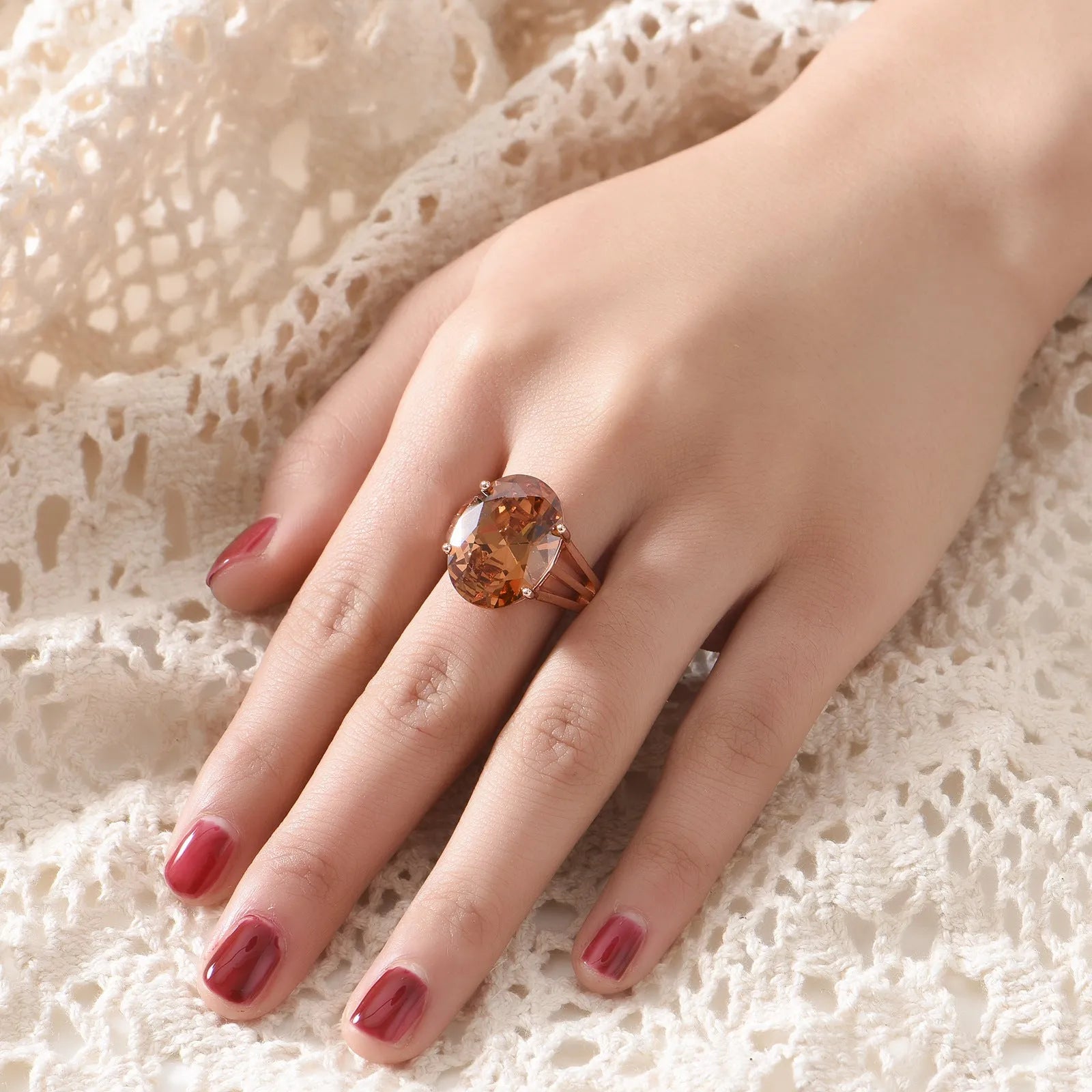Oval champagne zirconia closed ring with rose gold plating on copper base, adjustable fit sizes 6 to 9, geometric shape