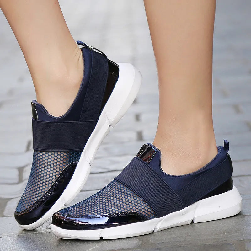 Blue, black, and grey low-top women's casual sneakers with mesh interior and PU midsole.