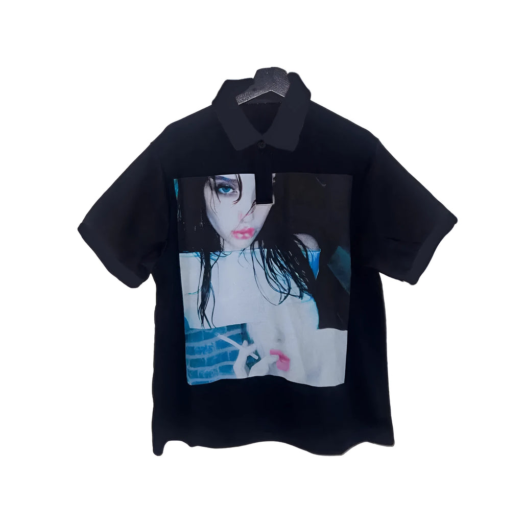 Short-sleeved printed polo shirt in polyester fabric on a hanger