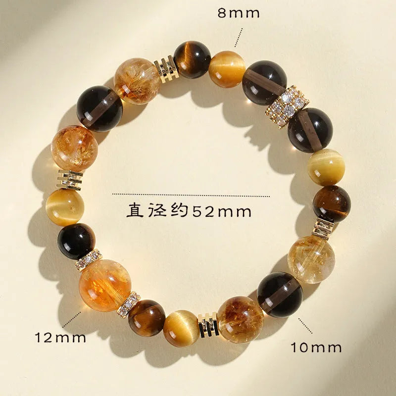 Close-up of a women's bracelet with large 10mm natural yellow artificial crystal beads on a string.