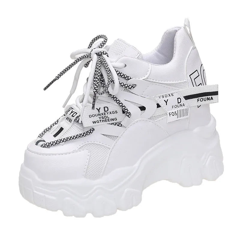 Women's white breathable mesh platform sports shoes with cross strap and rubber sole.