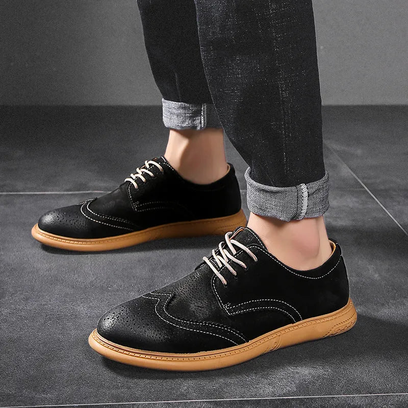 Men's black leather low-top lace-up business shoes with a rubber sole on a plain background.