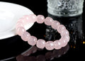 Pink crystal barrel bead bracelet with 11-12mm geometric beads on natural background