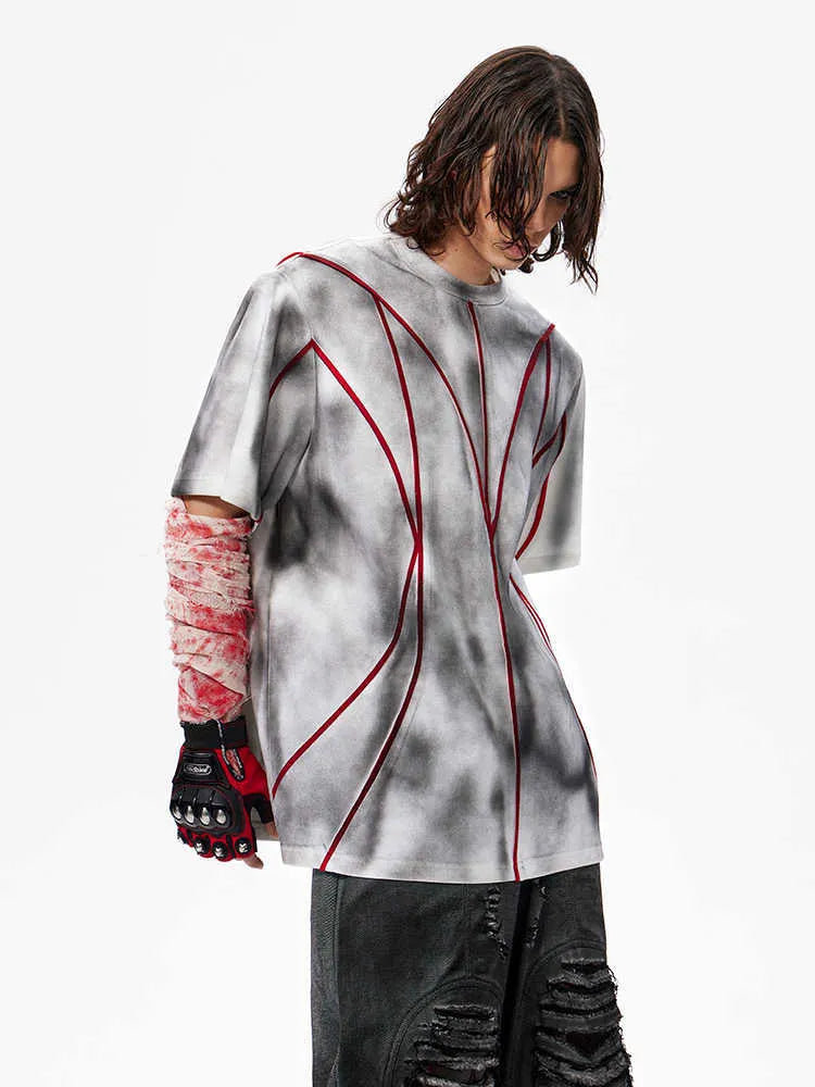 Padded shoulder short sleeve T-shirt with three-dimensional line patchwork design in picture colour.