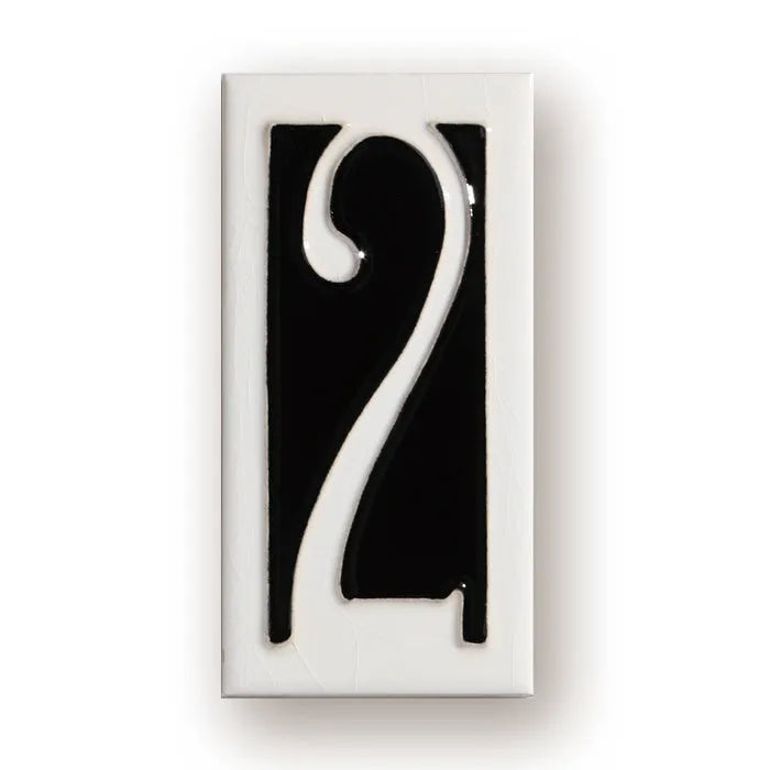 Handmade retro enamel ceramic doorplate showing a number on a glossy surface