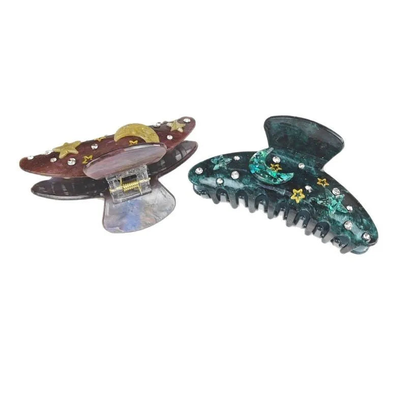 Oversized women's barrette with star moon starry sky pattern in sky blue colour.