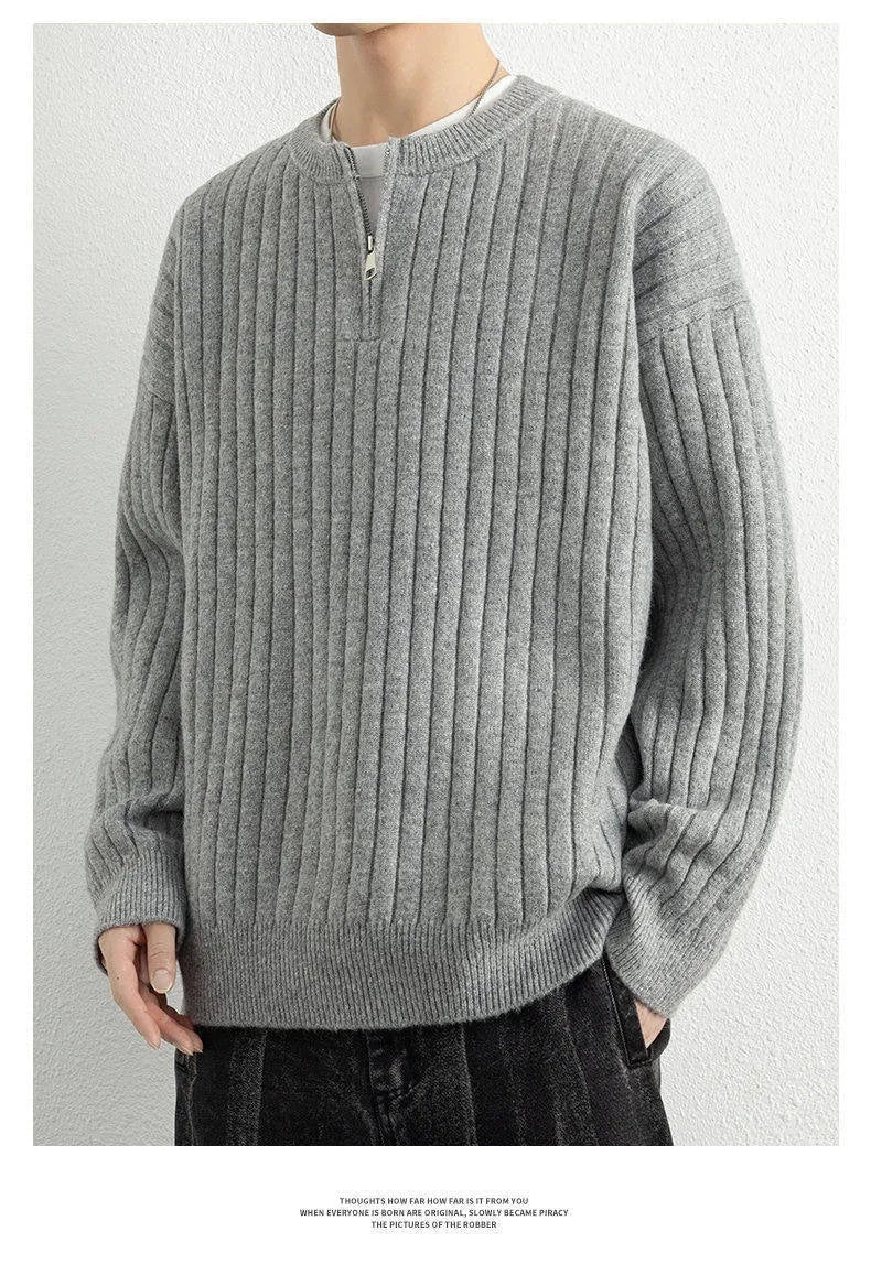 Men's grey loose-fit half zip textured knit sweater on a hanger