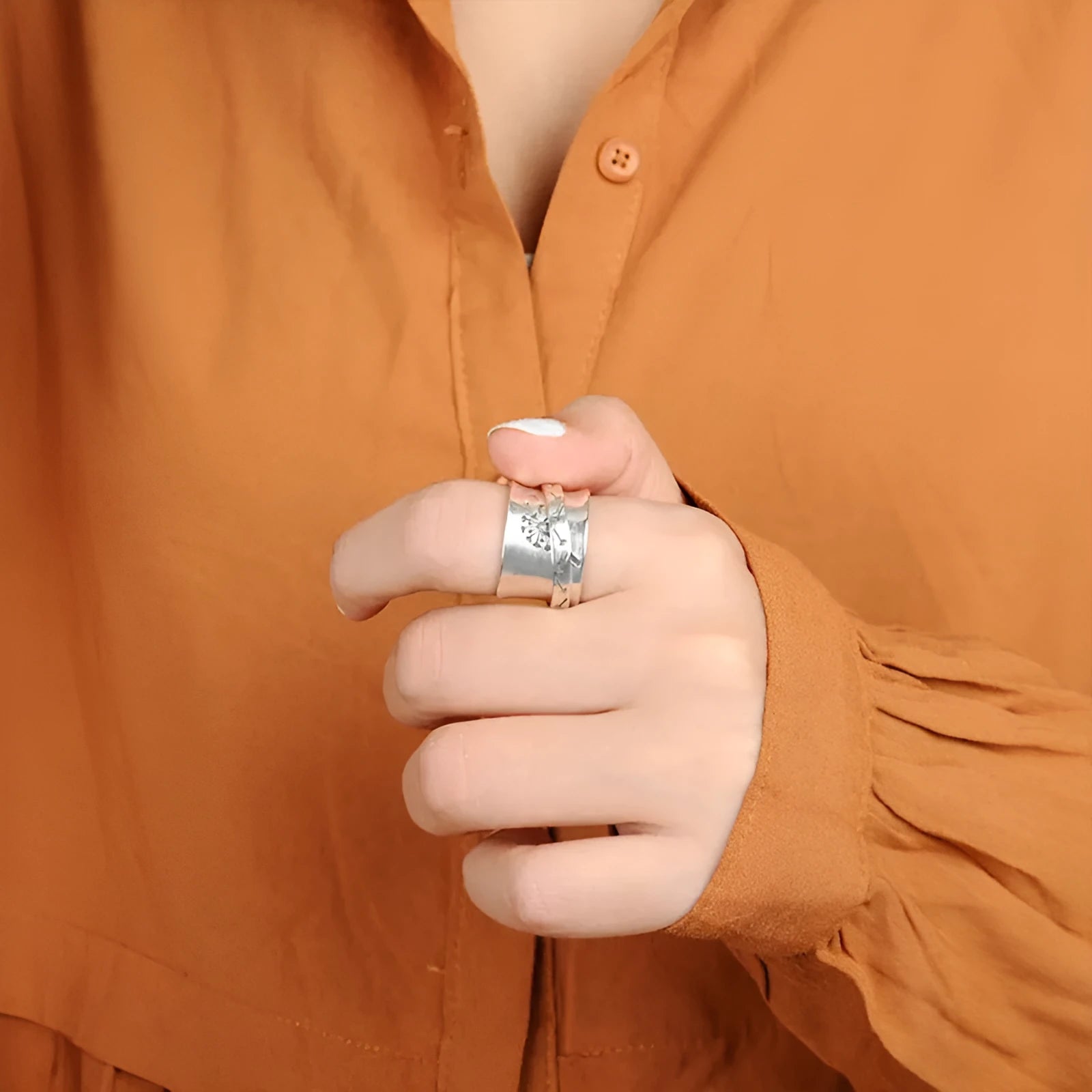 Silver electroplated rotatable flower ring showing adjustable design and flower shape