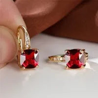 Square geometric ear hook studs with a round zircon stone, shown in a gold electroplated finish.