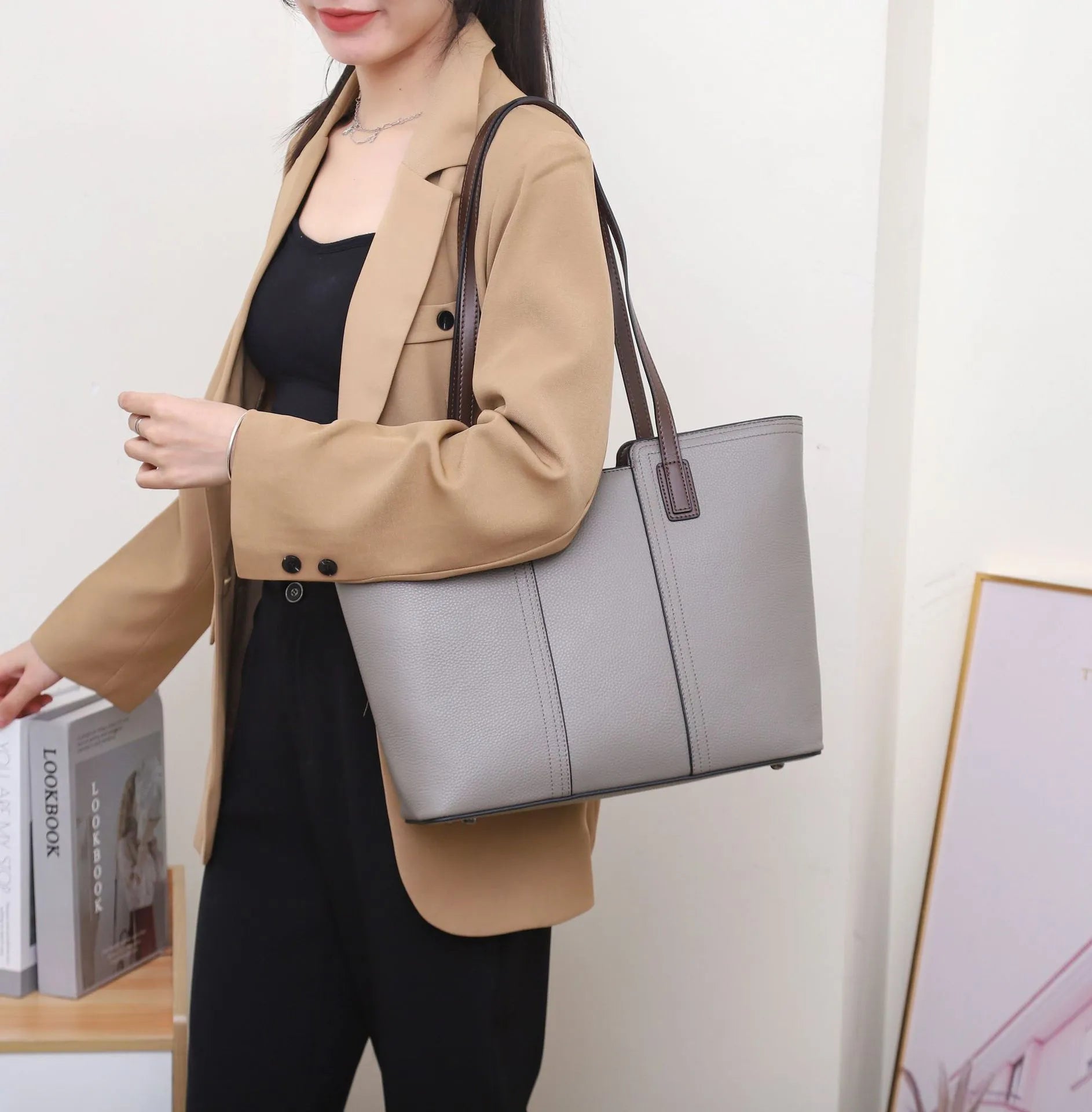 Women's genuine leather shoulder bag in khaki colour showing box-type design and organised interior compartments